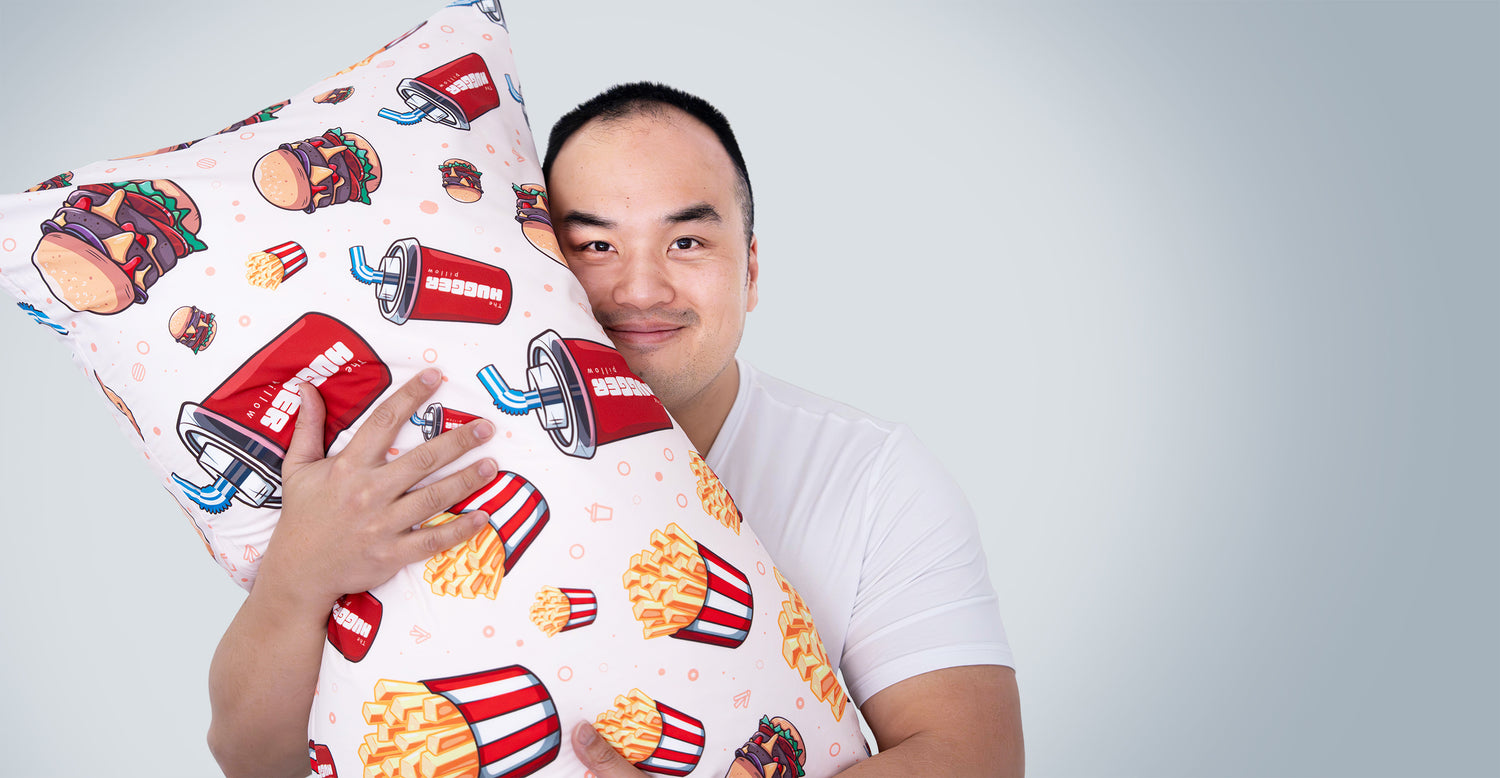 Cover image of The Hugger Pillow founder, Andrew, hugging The Hugger Pillow Hugger Meal Set 